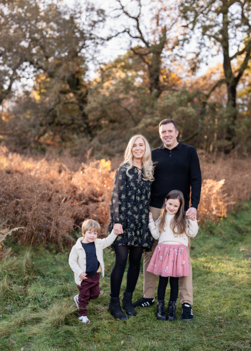 Photo of Kelly and her family in a park. Kelly is a residential interior designer based in Manchester.