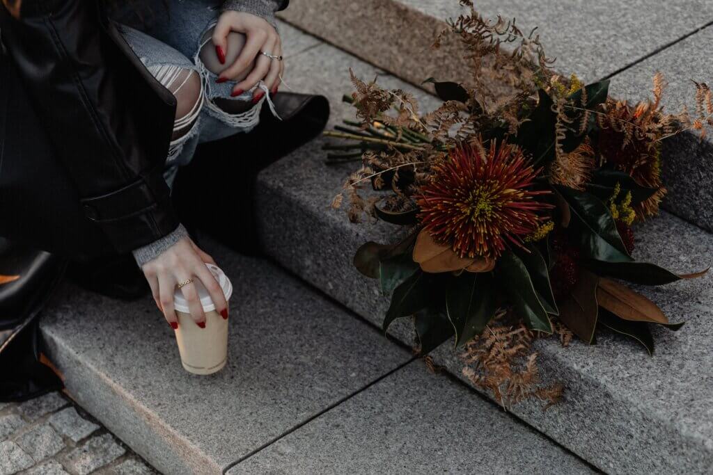 LAdy with dried flowers to illustrate Autumn 2024 Interior Design and Decor Trends