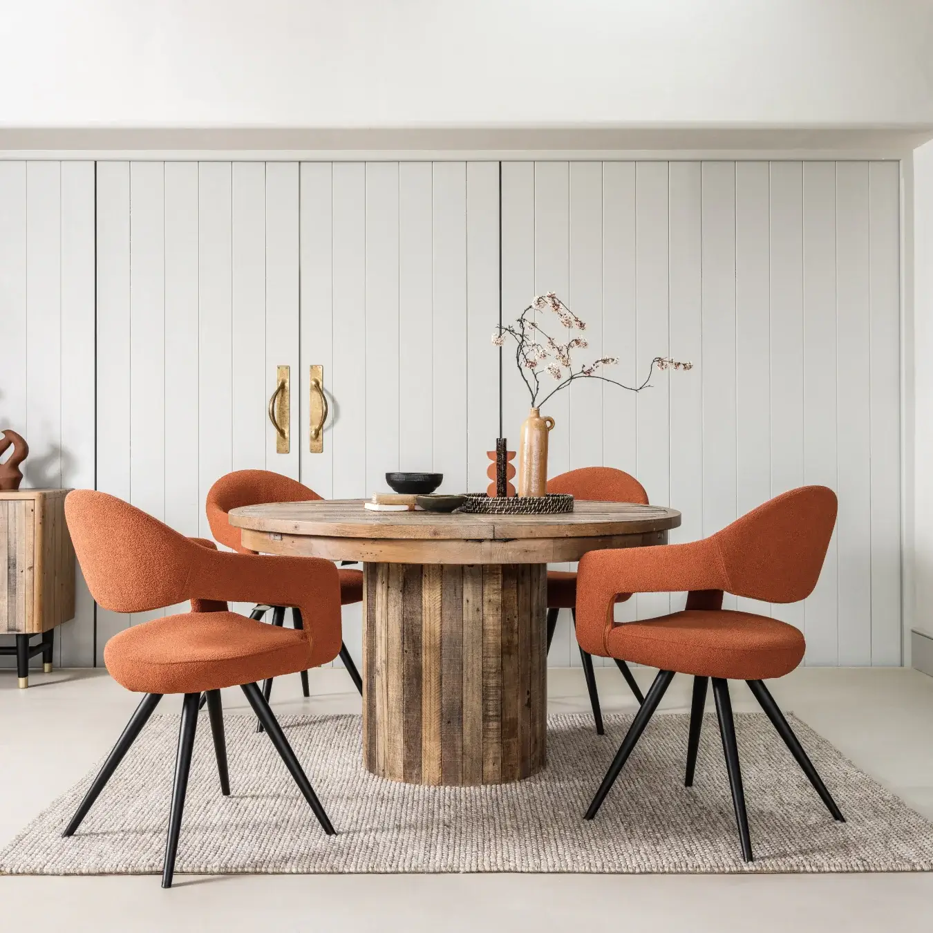 Autumn 2024 Interior Design and Decor Trends: Reclaimed wood dining table as an example of sustainable interior design